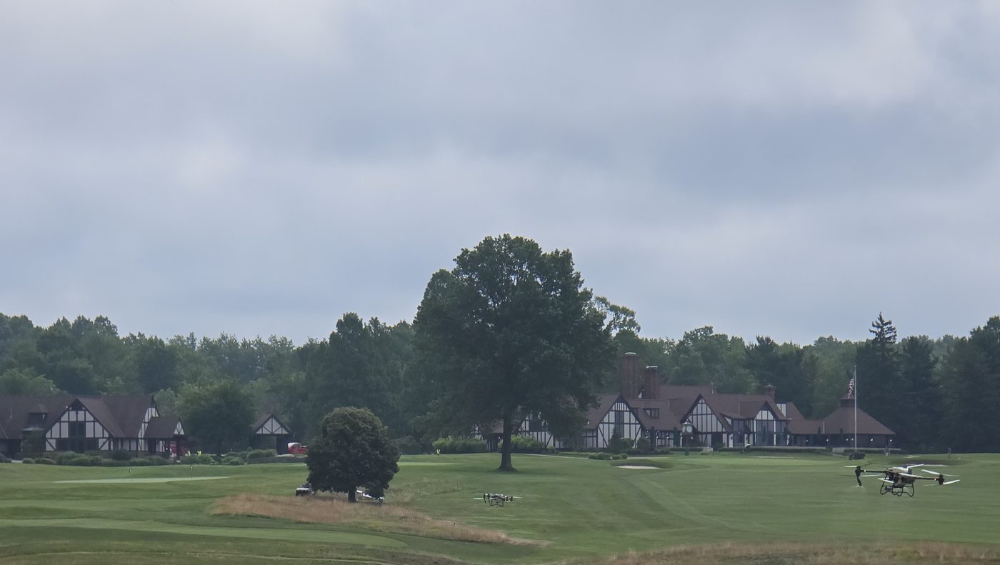 Two spray drones working the native areas in front of the clubhouse
